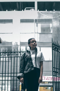 Young man standing in city