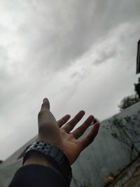 Midsection of person against sky