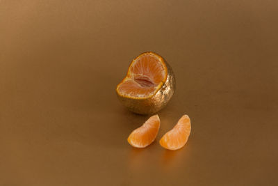 Close-up of fruit on table against white background