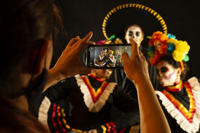 Woman photographing with mobile phone