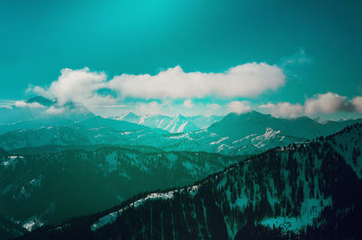 Scenic view of mountains against sky during winter