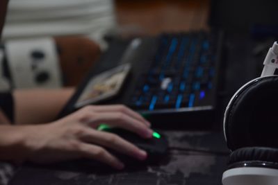 Close-up of man using computer