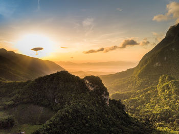 Scenic view of mountains against sky during sunset