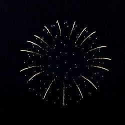 Low angle view of firework display at night