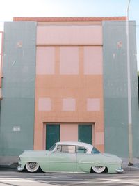Car on street against building