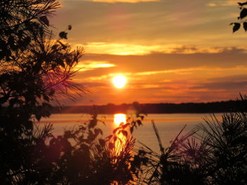 Scenic view of sea against romantic sky at sunset