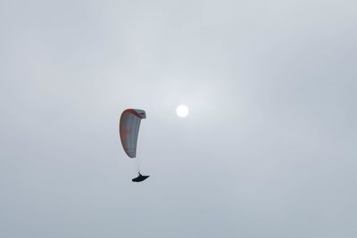 Low angle view of kite flying against sky