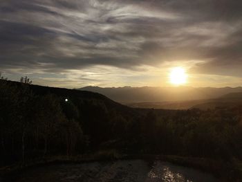 Scenic view of landscape against sky during sunset