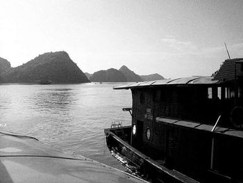 Calm sea with mountain range in background