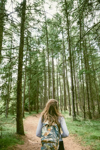 Rear view of woman in forest