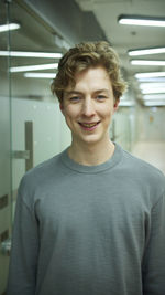 Portrait of smiling man standing indoors