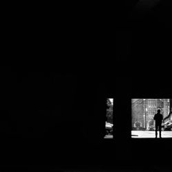 Silhouette of people standing against white background