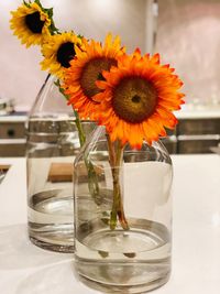 Close-up of sunflowers in vase on table