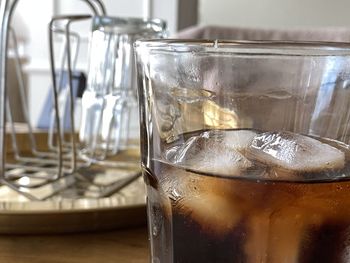 Close-up of ice glass on table