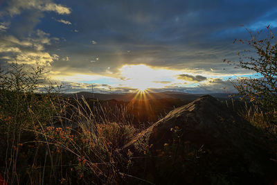 Sun shining through clouds