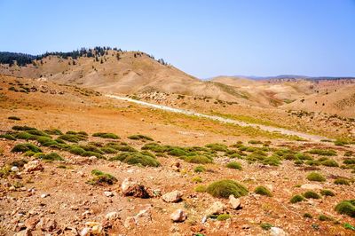 Scenic view of mountains against clear blue sky