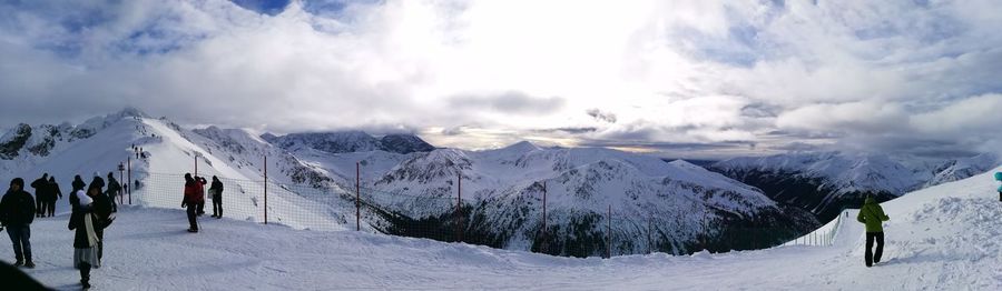 Panoramic view of snowcapped mountains against sky