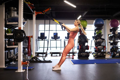 An athletic woman putting in time at the gym.