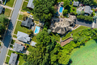 High angle view of houses and trees in town