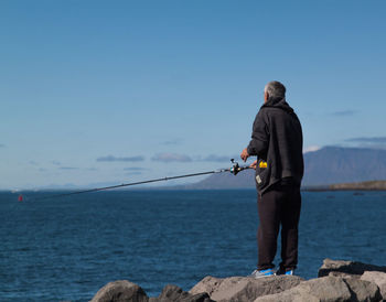 Woman standing on beach