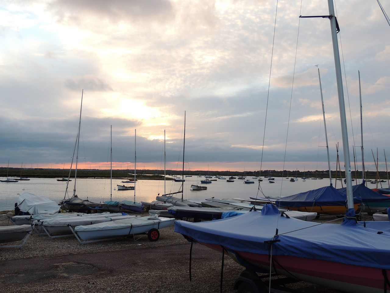 nautical vessel, moored, transportation, mode of transport, boat, water, sky, sea, harbor, mast, cloud - sky, sailboat, cloudy, cloud, nature, marina, travel, scenics, tranquility, outdoors