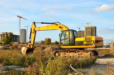 Construction site on field against sky