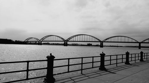 Rock island centennial bridge over mississippi river against sky