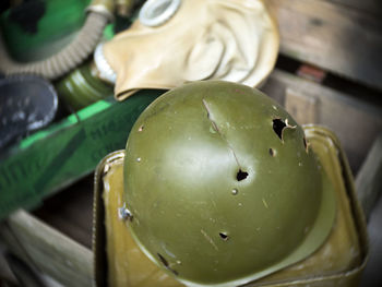 High angle view of pierced army helmet for exhibition at museum