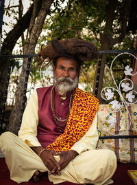 Portrait of a man sitting in temple