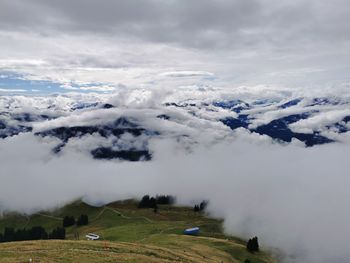 Scenic view of snow covered mountains against sky