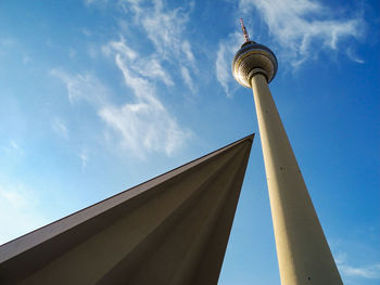 Low angle view of tower against cloudy sky