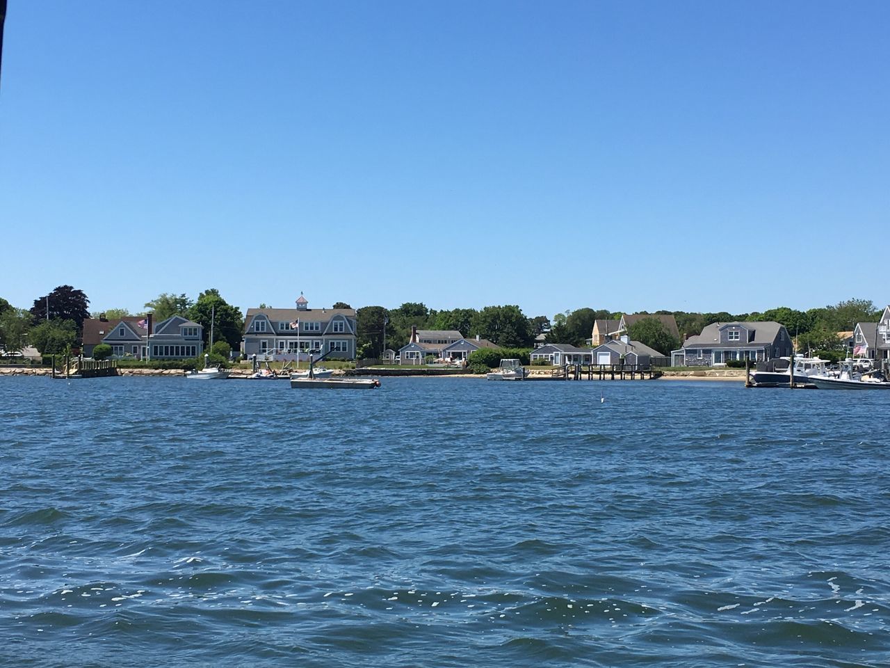 water, clear sky, blue, waterfront, copy space, building exterior, built structure, architecture, sea, rippled, nautical vessel, river, house, city, tranquil scene, nature, tranquility, residential structure, scenics, day