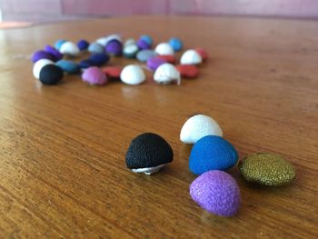 Close-up of multi colored balls on table