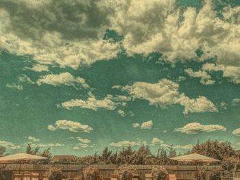 Low angle view of building against cloudy sky