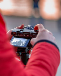 Close-up of hand holding camera