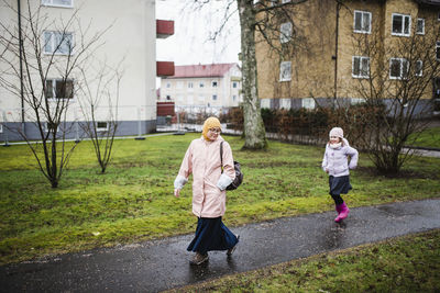 Mother with daughter walking together