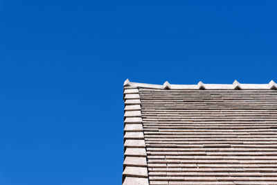 Low angle view of building against clear blue sky