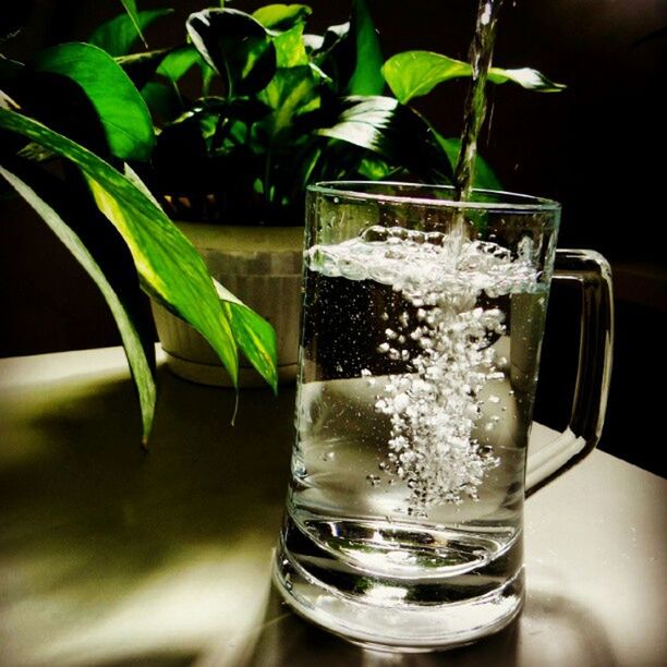 food and drink, freshness, drink, drinking glass, refreshment, close-up, glass - material, table, indoors, transparent, water, leaf, focus on foreground, glass, drinking straw, still life, ice, cold temperature, healthy eating, cocktail