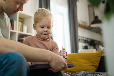 Side view of boy looking at home