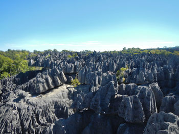 Panoramic view of rocks on land against sky