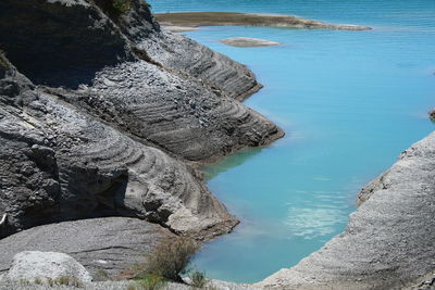 High angle view of rocks on sea