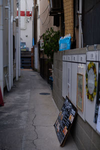 Footpath amidst buildings in city