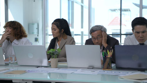 Group of people working on table