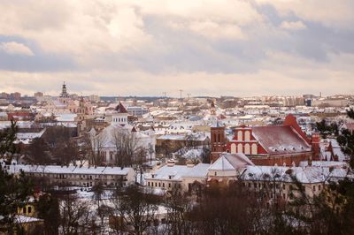 Townscape against sky during winter