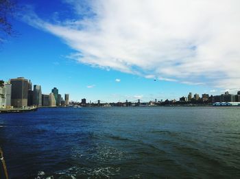 View of cityscape against blue sky