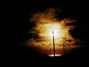 Low angle view of street light against sky at night