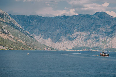 Scenic view of sea against mountains
