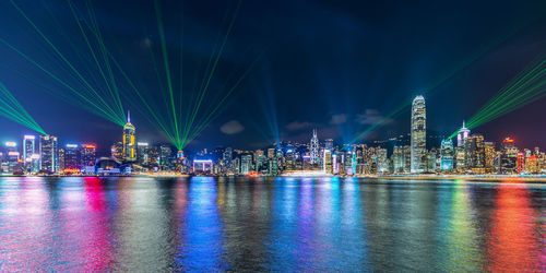 Illuminated city at waterfront