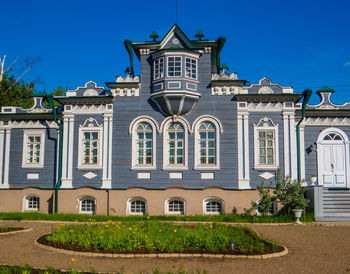 Low angle view of building against blue sky