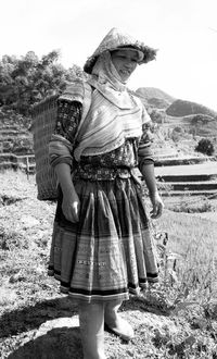 Young woman standing on field